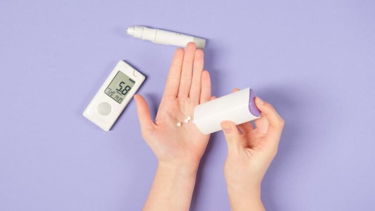 Close-up of hands using diabetes tools with a glucose monitor on a purple background.