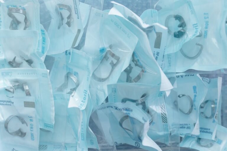 Sterile dental instruments in sealed packages, ready for medical use.