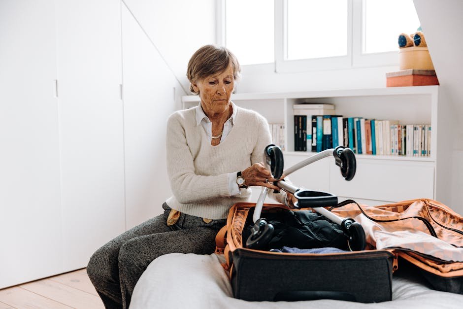 Elderly woman packing a rollator in an indoor setting, surrounded by books.