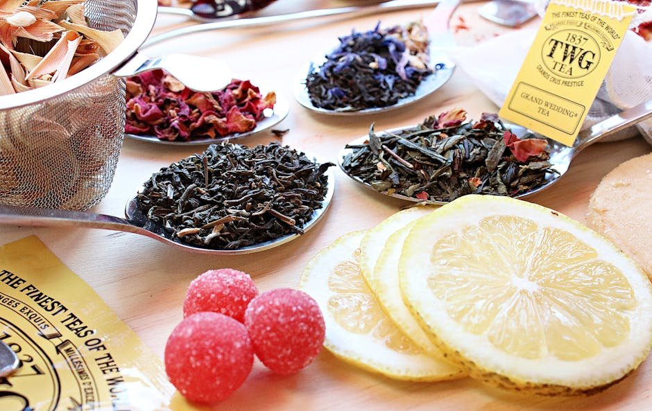Close-up of various tea ingredients with lemon slices, perfect for organic tea lovers.