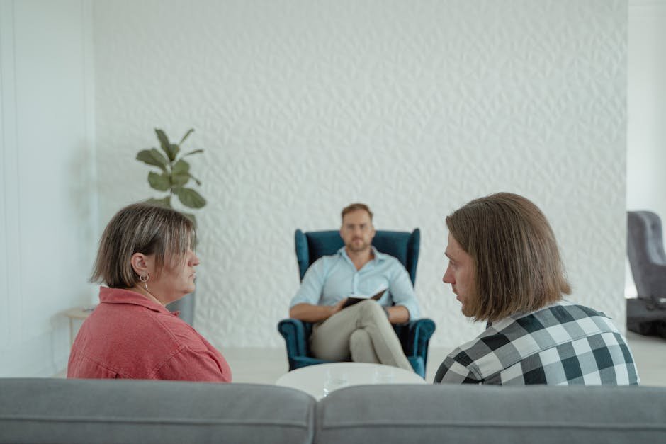 Image of a counseling session with a professional advisor, focusing on a couple's discussion.